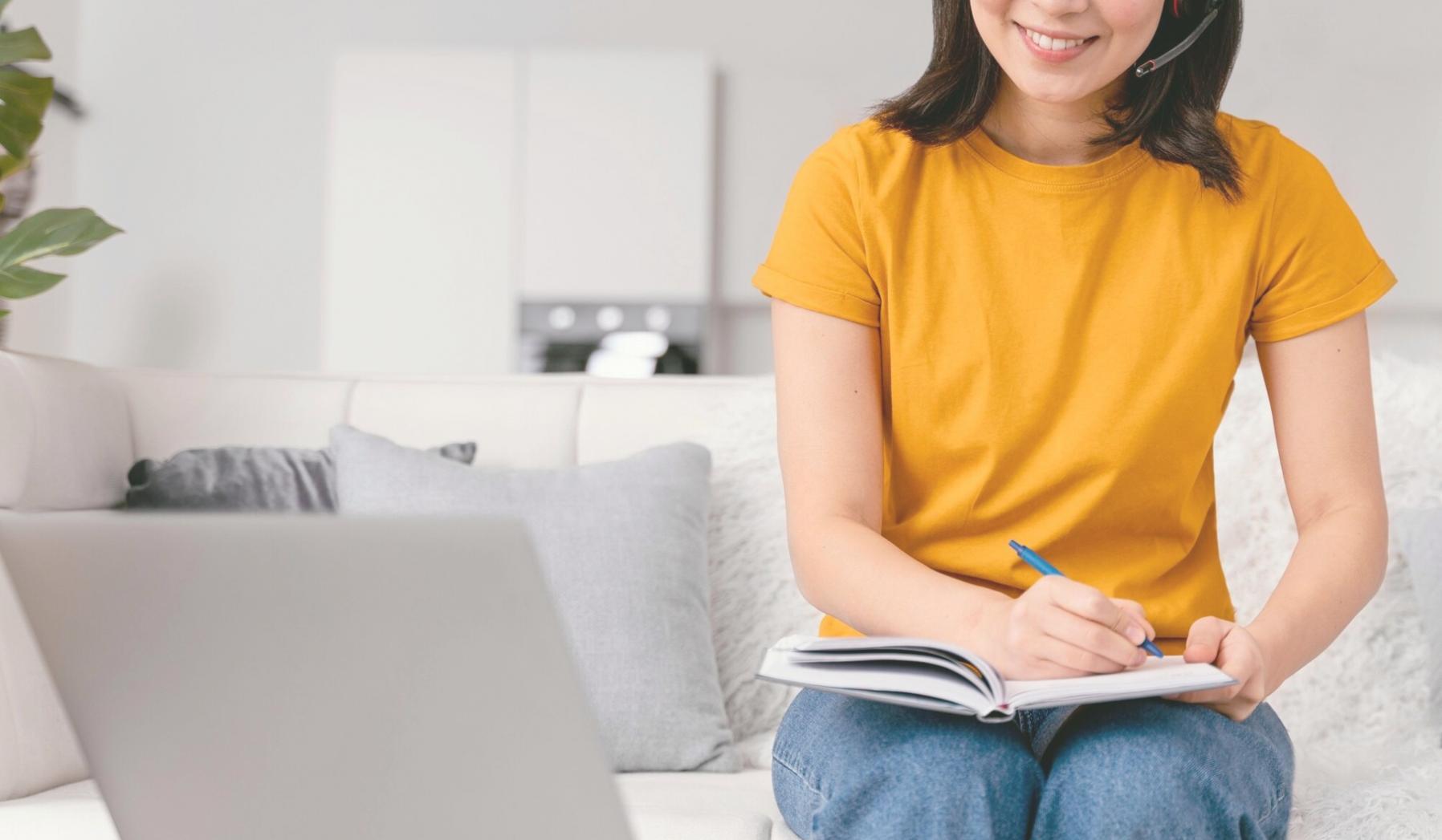 Organized remote learning workspace with dual monitor setup for financial analysis