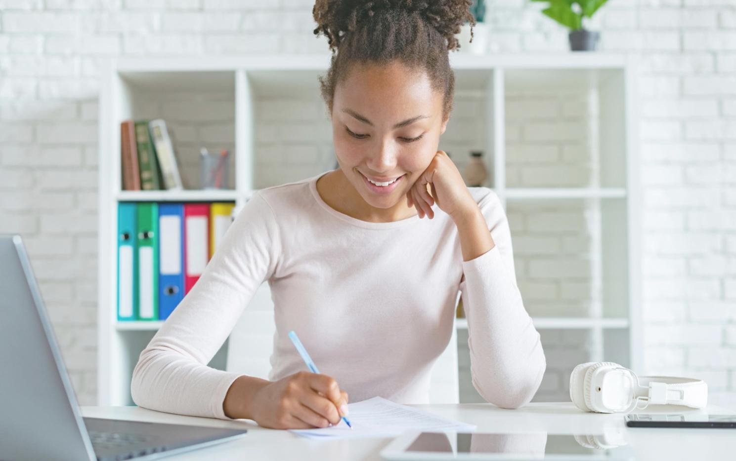 Students collaborating on financial analysis project with detailed spreadsheets and market research