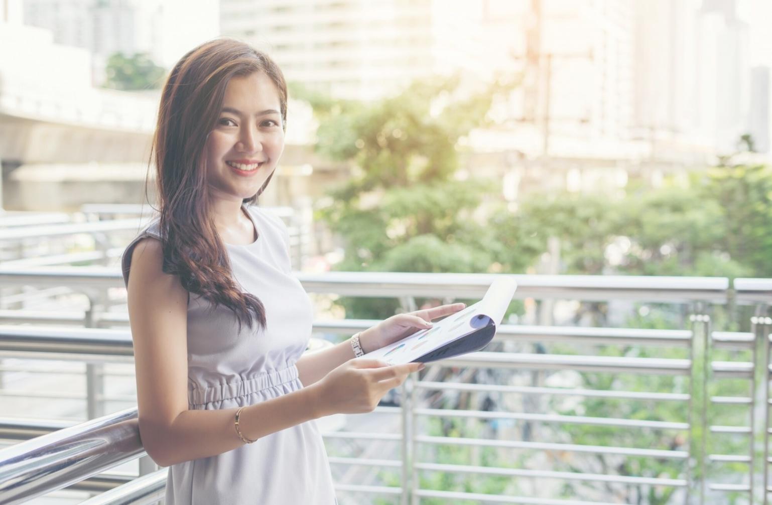 Professional analyzing financial projections and business scenarios on laptop